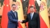 In this photo released by China's Xinhua News Agency, Chinese President Xi Jinping, right, meets with Spanish Prime Minister Pedro Sanchez in Beijing, Friday, March 31, 2023.
