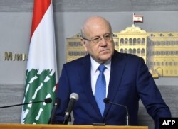 FILE - Lebanese caretaker Prime Minister Najib Mikati speaks following a cabinet meeting in Beirut, March 27, 2023, in a handout picture provided by the Lebanese photo agency Dalati and Nohra.