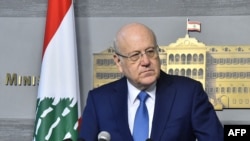 FILE - Lebanese caretaker Prime Minister Najib Mikati speaks following a cabinet meeting in Beirut, March 27, 2023, in a handout picture provided by the Lebanese photo agency Dalati and Nohra. 