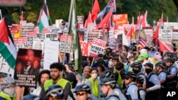 Protesters march during a demonstration near the Democratic National Convention, Aug. 22, 2024, in Chicago.