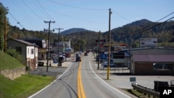 Cars drive along Main Street in Danville, West Virginia, Oct. 13, 2020.