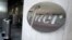 FILE - The Pfizer logo identifies the pharmaceutical company's headquarters in New York, Nov. 9, 2020.
