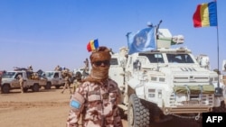 FILE - This photo taken by MINUSMA on Oct. 25, 2023, shows a Chadian soldier with the United Nations Multidimensional Integrated Stabilization Mission in Mali (MINUSMA) standing in front of a convoy outside the city of Gao, Mali.