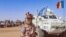 FILE - This photo taken by MINUSMA on Oct. 25, 2023, shows a Chadian soldier with the United Nations Multidimensional Integrated Stabilization Mission in Mali (MINUSMA) standing in front of a convoy outside the city of Gao, Mali.