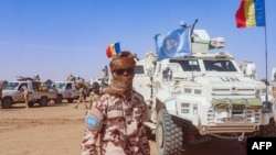 FILE - This photo taken by MINUSMA on Oct. 25, 2023, shows a Chadian soldier with the United Nations Multidimensional Integrated Stabilization Mission in Mali (MINUSMA) standing in front of a convoy outside the city of Gao,