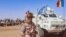FILE - This photo taken by MINUSMA on Oct. 25, 2023, shows a Chadian soldier with the United Nations Multidimensional Integrated Stabilization Mission in Mali (MINUSMA) standing in front of a convoy outside the city of Gao,