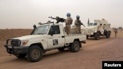 FILE: U.N. peacekeepers patrol in Kidal, Mali, July 23, 2015. France has proposed the end of U.N. Mali operations on June 30 to the Security Council, which has yet to decide.