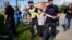 FILE - Climate activist Greta Thunberg is detained by police during an action for blocking the entrance to an oil facility in Malmo, Sweden, July 24, 2023.