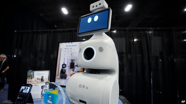 The ORo robot dog companion by is displayed during CES Unveiled before the start of the CES tech show Sunday, Jan. 7, 2024, in Las Vegas. The robot is designed to interact with, feed, and distribute medication for pets. (AP Photo/Ryan Sun)