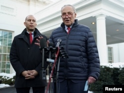 FILE - U.S. Senate Majority Leader Chuck Schumer, right, and U.S. House of Representatives Democratic leader Hakeem Jeffries stand outside the White House, Jan. 17, 2024. They met separately with U.S. President Joe Biden this week to discuss his 2024 election prospects.