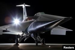 The experimental quiet supersonic aircraft X-59, a collaboration of Lockheed Martin's Skunk Works and NASA, is seen parked in a hangar in Palmdale, California, U.S. December 12, 2023. (Lockheed Martin/Garry Tice/Handout via REUTERS)