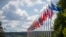 FILE — Flags of NATO member countries flap outside the venue of the NATO summit in Vilnius, Lithuania, July 9, 2023. Washington and NATO allies said Tuesday they will echo Russia's suspension of a Cold War treaty to limit conventional arms proliferation in Europe.