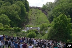 APTOPIX Britain Cheese Rolling