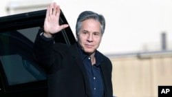 FILE — U.S. Secretary of State Antony Blinken waves before boarding a plane at Andrews Air Force Base in Maryland, Nov. 27, 2023. An official says the secretary will board a plane again on late Thursday for a trip to the Middle East.