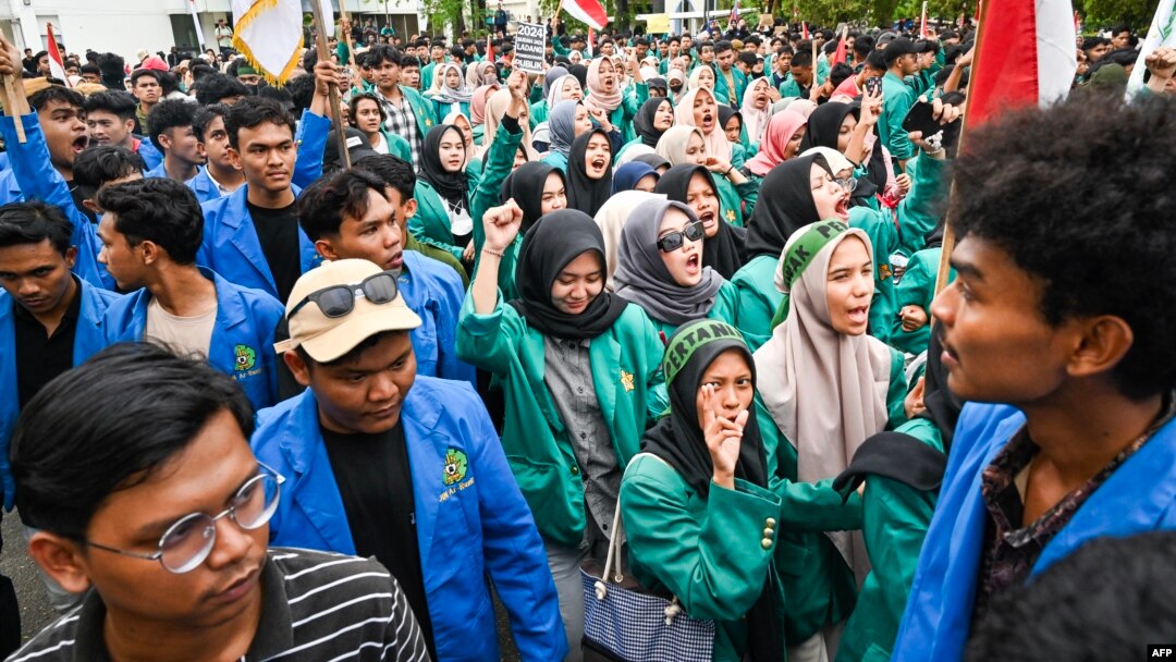 University students shout slogans during a protest against a move to overturn a Constitutional Court ruling that changed eligibility rules for candidates in the general election later this year, in Banda Aceh, Indonesia, Aug. 23, 2024. 
