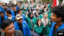 University students shout slogans during a protest against a move to overturn a Constitutional Court ruling that changed eligibility rules for candidates in the general election later this year, in Banda Aceh, Indonesia, Aug. 23, 2024. 