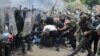 NATO Kosovo Force (KFOR) soldiers clash with local Kosovo Serb protesters at the entrance of the municipality office, in the town of Zvecan, Kosovo, May 29, 2023.