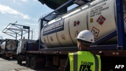 FILE - Trucks containing crude oil are seen at Kenya Petroleum Refineries plant in Mombasa, on June 7, 2018. 