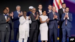 Democratic veterans serving in local, state and federal levels of government stand alongside Rep. Ruben Gallego during the Democratic National Convention, Aug. 22, 2024, in Chicago.