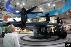 The Archer midnight flying taxi is exhibited at the Paris Air Show, Wednesday, June 21, 2023 in Le Bourget, north of Paris. (AP Photo/Michel Euler)