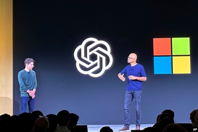 FILE - Sam Altman, left, appears onstage with Microsoft CEO Satya Nadella at OpenAI's first developer conference, on Nov. 6, 2023, in San Francisco. (AP Photo/Barbara Ortutay, File)