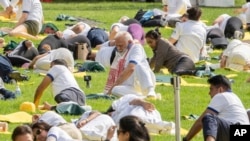 India Prime Minister Narendra Modi, center, practices yoga during the International Day of Yoga event at U.N. headquarters in New York, June 21, 2023. Modi is on a state visit to the U.S.