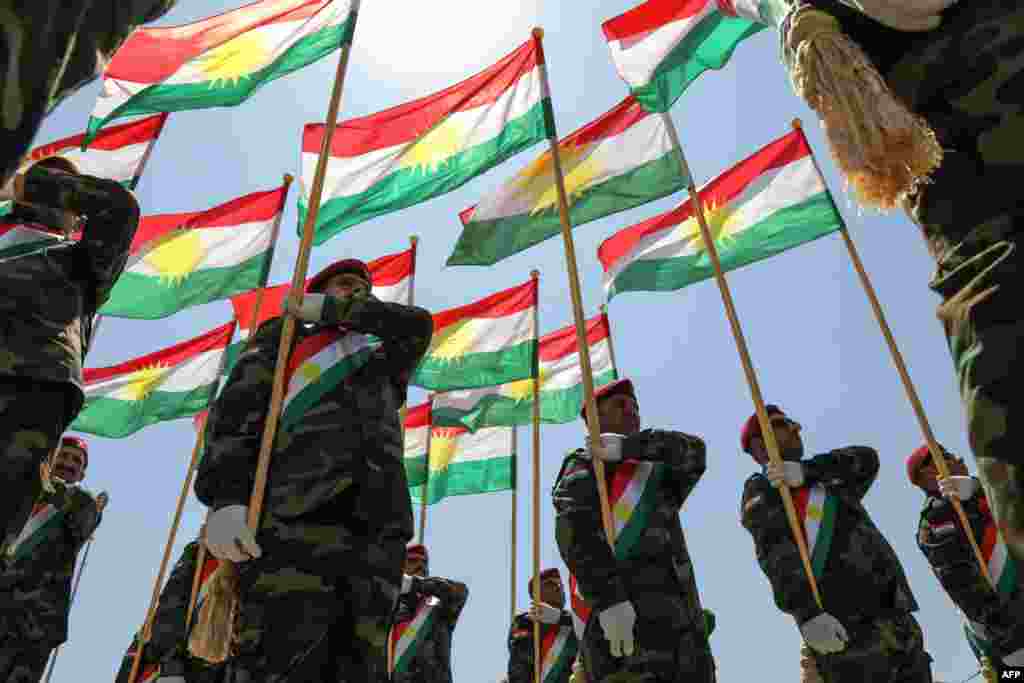 Iraqi-Kurdish Peshmerga officers take part in a graduation ceremony in Irbil, the capital of Iraq's northern autonomous Kurdish region.