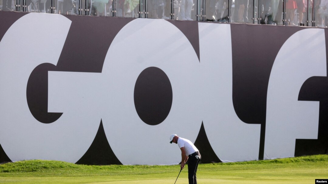 FILE - England's Sam Horsfield putts during the inaugural LIV Golf Invitational at Centurion Club, Hemel Hempstead, Britain, June 10, 2022. The Saudi-backed LIV Golf league is merging with the U.S. and European men's professional golf leagues.  