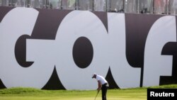 FILE - England's Sam Horsfield putts during the inaugural LIV Golf Invitational at Centurion Club, Hemel Hempstead, Britain, June 10, 2022. The Saudi-backed LIV Golf league is merging with the U.S. and European men's professional golf leagues.  