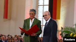 Karin Schnidt-Friedrichs, the head of German Booksellers and Publishers Association speaks as author Salman Rushdie receives the Peace Prize of the German book trade during a ceremony in Frankfurt, Oct. 22, 2023. (Reuters/Kai Pfaffenbach/Pool)