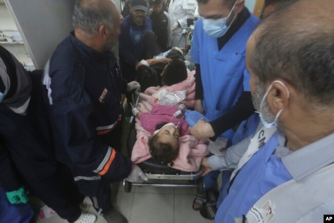 Palestinians wounded during the Israeli air and ground offensive in Khan Younis are brought to a hospital in Rafah, Gaza Strip, Jan. 23, 2024.