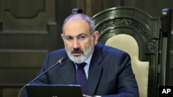 FILE — Armenian Prime Minister Nikol Pashinyan leads a cabinet meeting in Yerevan, Armenia, Sept. 22, 2023. Pashinyan said on Saturday that his country and Azerbaijan are speaking "different diplomatic languages."(Tigran Mehrabyan/PAN Photo via AP)