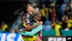Colombia's Carolina Arias, left, and Daniela Caracas celebrate at the end of the Women's World Cup Group H soccer match between Germany and Colombia at the Sydney Football Stadium in Sydney, July 30, 2023. Colombia won 2-1. 