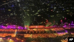 Lamps light up the banks of the river Saryu on the eve of the Hindu festival of Diwali, in Ayodhya, India, Nov. 11, 2023.