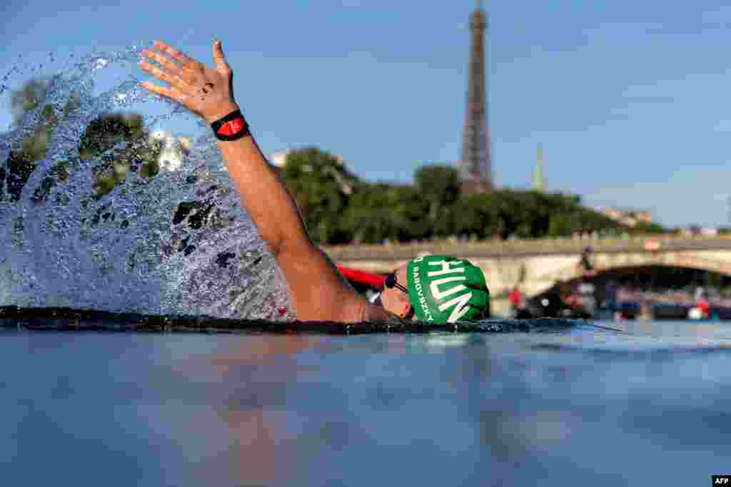 Hungary&#39;s Kristof Rasovszky backstrokes through the Seine during the men&#39;s 10-kilometer marathon swimming final at the Paris 2024 Olympic Games at Pont Alexandre III in Paris.