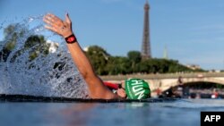 Hungary&#39;s Kristof Rasovszky backstrokes through the Seine during the men&#39;s 10-kilometer marathon swimming final at the Paris 2024 Olympic Games at Pont Alexandre III in Paris.