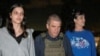 Judith Raanan and daughter Natalie Raanan, U.S. citizens who were Hamas hostages, walk with retired Brig. Gen. Gal Hirsch, Israel's coordinator for the captives and missing, after their release, in this handout photo, Oct. 20, 2023.