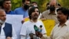 FILE - Pakistani journalist Asad Ali Toor, center, speaks during a demonstration called by a journalists union to condemn attacks on journalists, in Islamabad, May 28, 2021.