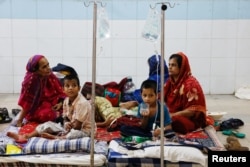 FILE - Dengue-infected people are hospitalized for treatment at Mugda Medical College and Hospital, in Dhaka, Bangladesh, Sept. 5, 2023.