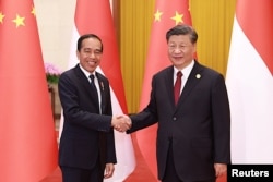 Chinese President Xi Jinping and President Joko Widodo shake hands on the sidelines of the Belt and Road Forum in Beijing, China, October 17, 2023. (Photo: via Reuters)