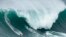 Maya Gabeira, from Brazil, rides a wave during the Nazare Big Wave Challenge surfing tournament at Praia do Norte, or North Beach, in Nazare, Portugal, Jan. 22, 2024.