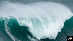 Maya Gabeira from Brazil rides a wave during the Nazare Big Wave Challenge surfing tournament at Praia do Norte, or North Beach, in Nazare, Portugal.