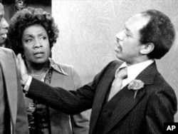 FILE - Isabel Sanford and Sherman Hemsly, as Louise and George Jefferson, perform in a scene from the television series "The Jeffersons."