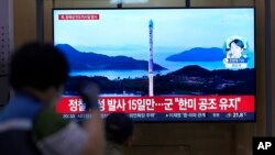A TV screen shows a report of North Korea's missile launch with file image during a news program at the Seoul Railway Station in Seoul, South Korea, June 15, 2023.