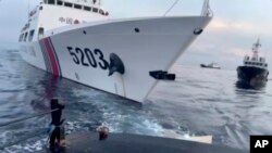 This image shows a Chinese coast guard ship with bow number 5203 after bumping a Filipino supply boat as they approach Second Thomas Shoal in South China Sea on Sunday Oct. 22, 2023. (Armed Forces of the Philippines via AP)