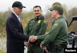 U.S. President Joe Biden greets members of the U.S. Border Patrol at the U.S.-Mexico border in Brownsville, a city in the U.S. state of Texas, Feb. 29, 2024. The same day, former U.S. President Donald Trump visited another border community.