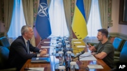 NATO Secretary General Jens Stoltenberg, left, and Ukrainian President Volodymyr Zelenskyy talk during their meeting in Kyiv, Ukraine, Sept. 28, 2023. (Ukrainian Presidential Press Office via AP)