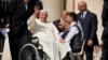 Pope Francis waves as he leaves after his weekly general audience in St. Peter's Square at The Vatican, Aug.28, 2024. 