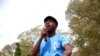 FILE - Itai Dzamara, an activist abducted by suspected state agents in 2015, addresses a gathering in Harare in March 6, 2015.