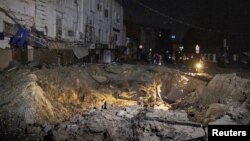 FILE - A view shows a crater left by a Russian missile strike, amid Russia's attack on Ukraine, in Kharkiv, Ukraine, June 6, 2023. The two sides have accused each other of blowing up a part of an ammonia pipeline in the Kharkiv region on June 5 or 6, 2023.